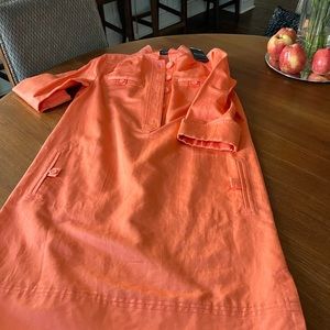Coral dress with three quarter sleeves and two pockets bran new with tags.